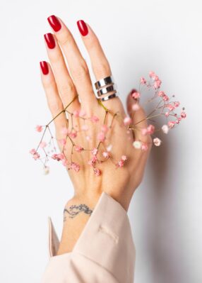 soft-gentle-photo-woman-hand-with-big-ring-red-manicure-hold-cute-little-pink-dried-flowers-white soft-gentle-photo-woman-hand-with-big-ring-red-manicure-hold-cute-little-pink-dried-flowers-white